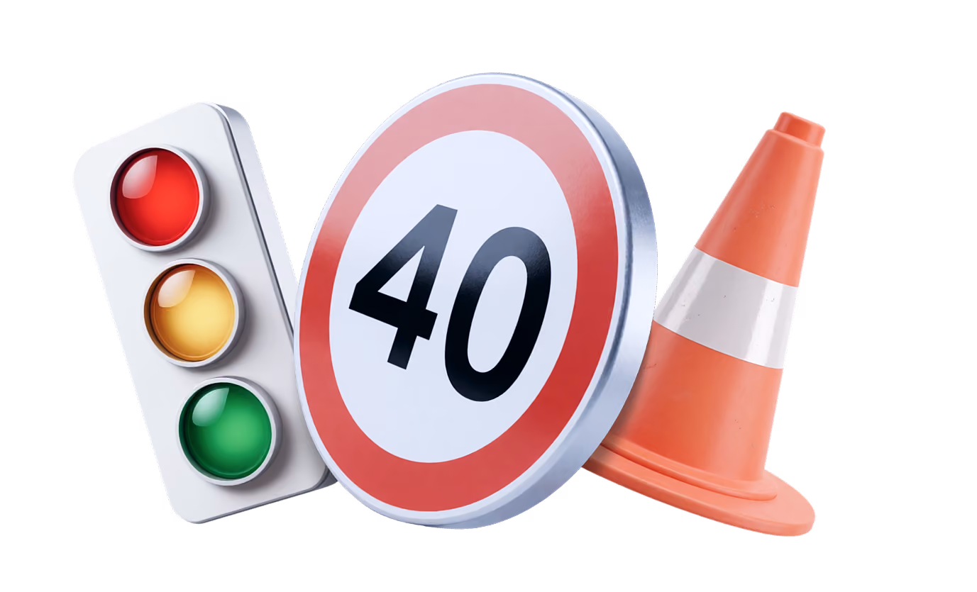 Traffic lights, a 40 km/h speed limit sign, and an orange traffic cone side by side.